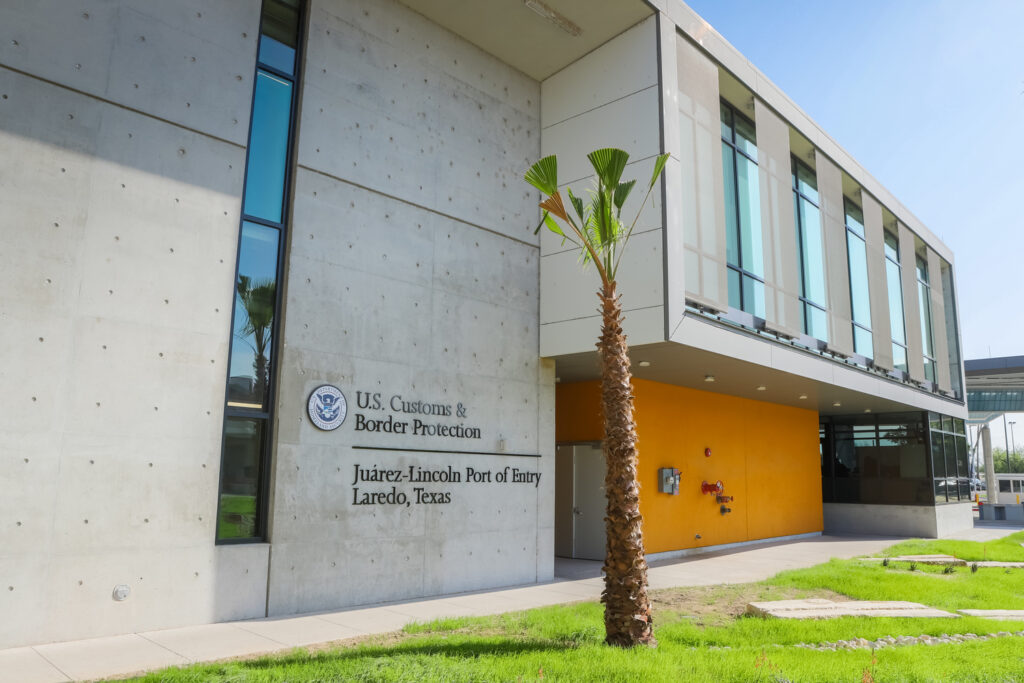 Modern border facility building, constructed by Vondace Contracting, with U.S. Customs and Border Protection signage at the Juárez-Lincoln Port of Entry in Laredo, Texas.