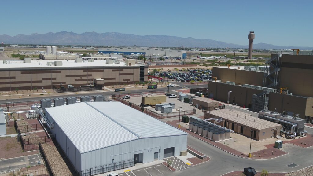 Industrial complex with parking lots and mountains in the distance, featuring ENR Texas & Louisiana projects.