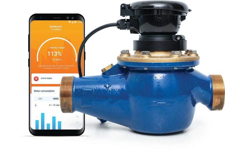 Smartphone displaying water leak damage data next to an industrial water meter managed by Vondace Contracting.