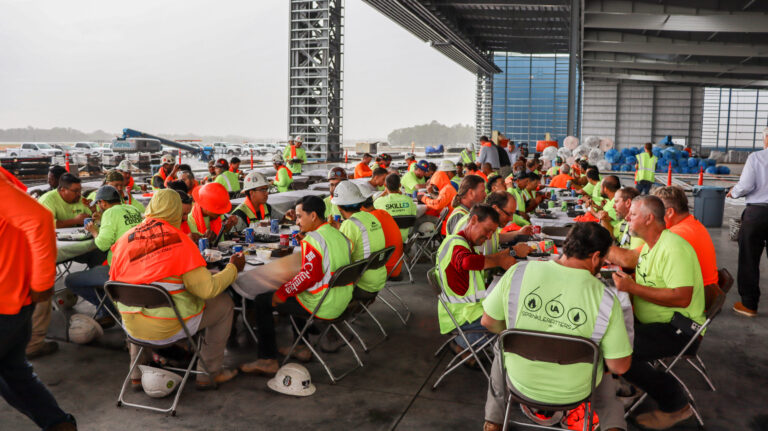 Construction workers taking a meal break at the Vondace Contracting Project Titan worksite.