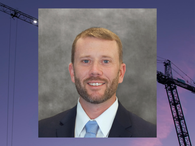 A headshot of a man in his mid-30s. The photo is layered over a photo of cranes.