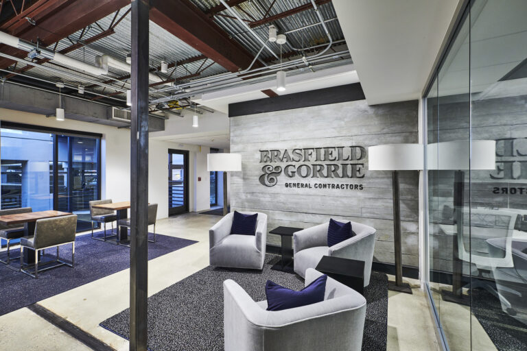 Modern office lobby in Birmingham, Alabama with the company name 