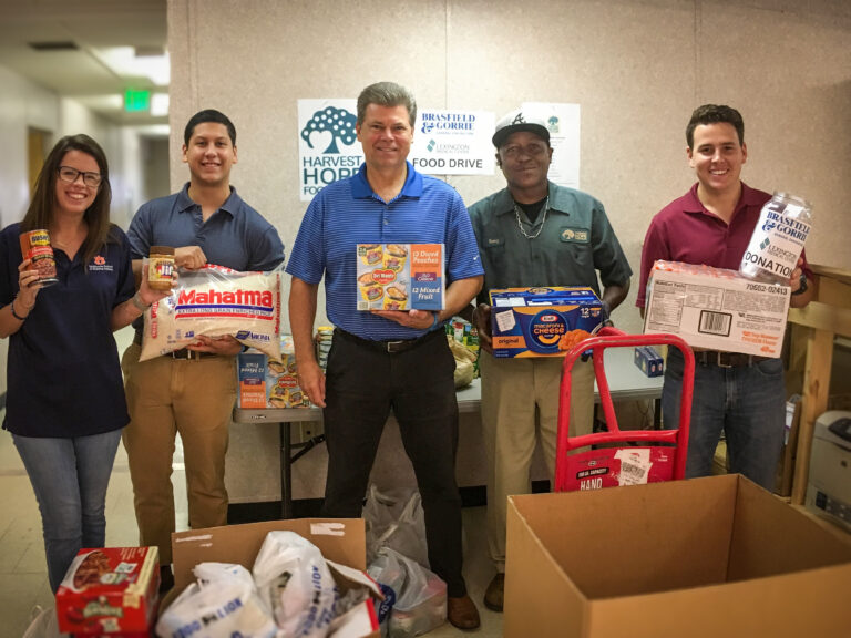 Volunteers in Charlotte NC collecting food donations for a local food drive.