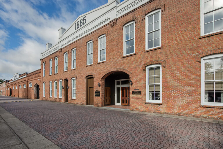 A brick building with a number on the front with first missouri state capitol state historic site in the background.