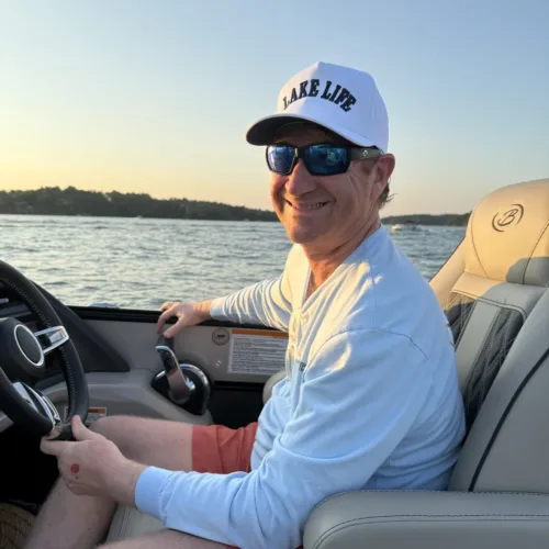 A man wearing sunglasses and a 